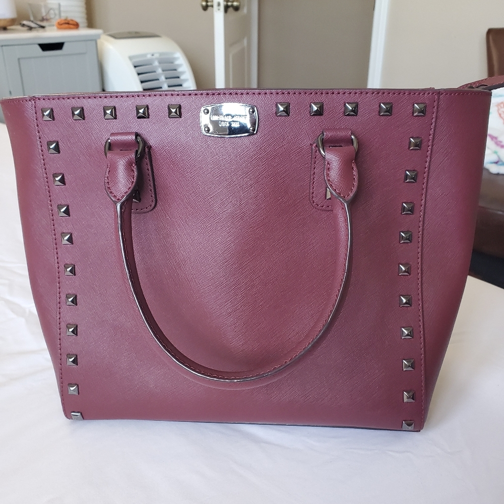 Burgundy Michael Kors bag with dark silver hardware